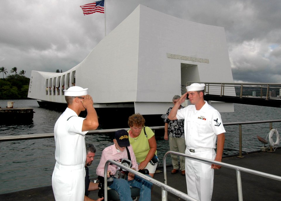 US Navy 051021-N-3019M-004 Sailors assigned to the USS Arizona Memorial Detachment render a salute to Pearl Harbor Survivor Hubert Harry Keil as he departs the USS Arizona Memorial
