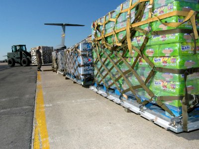 US Navy 051028-N-1328C-539 Food and water supplies for victims of Hurricane Wilma are staged prior to being loaded aboard a U.S. Air Force C-5 Galaxy cargo plane on board Naval Air Station Joint Reserve Base