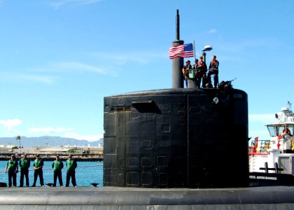US Navy 051027-N-0879R-004 The Los Angeles-class fast attack submarine USS Charlotte (SSN 766) prepares to depart her homeport of Pearl Harbor photo