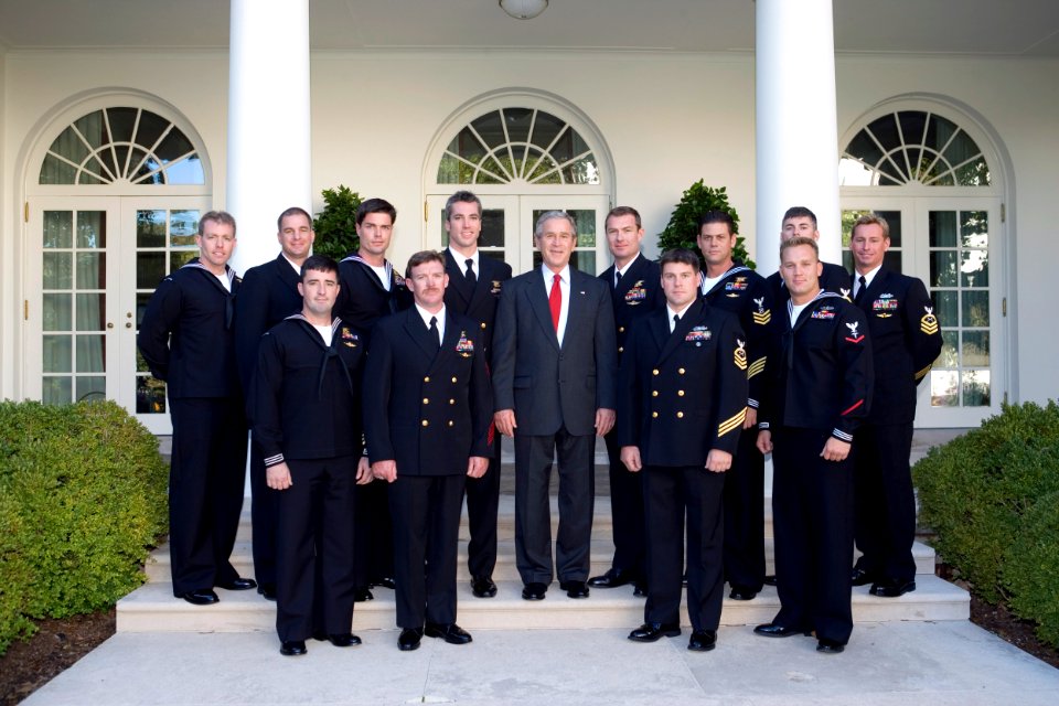 US Navy 051031-O-0201M-001 President George W. Bush pose for a photo with the U.S. Navy Parachute Team Leap Frogs outside the Oval Office