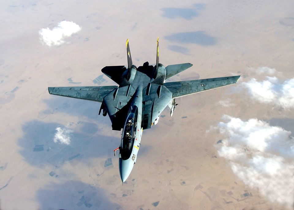 US Navy 051105-F-5480T-008 An F-14D Tomcat deploys its fuel probe prior to aerial refueling during a mission over the Persian Gulf-region