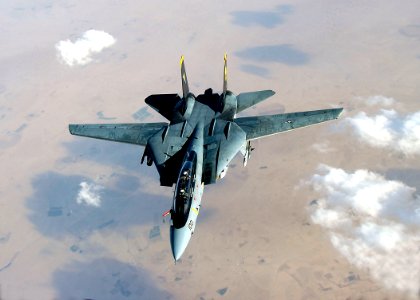 US Navy 051105-F-5480T-008 An F-14D Tomcat deploys its fuel probe prior to aerial refueling during a mission over the Persian Gulf-region