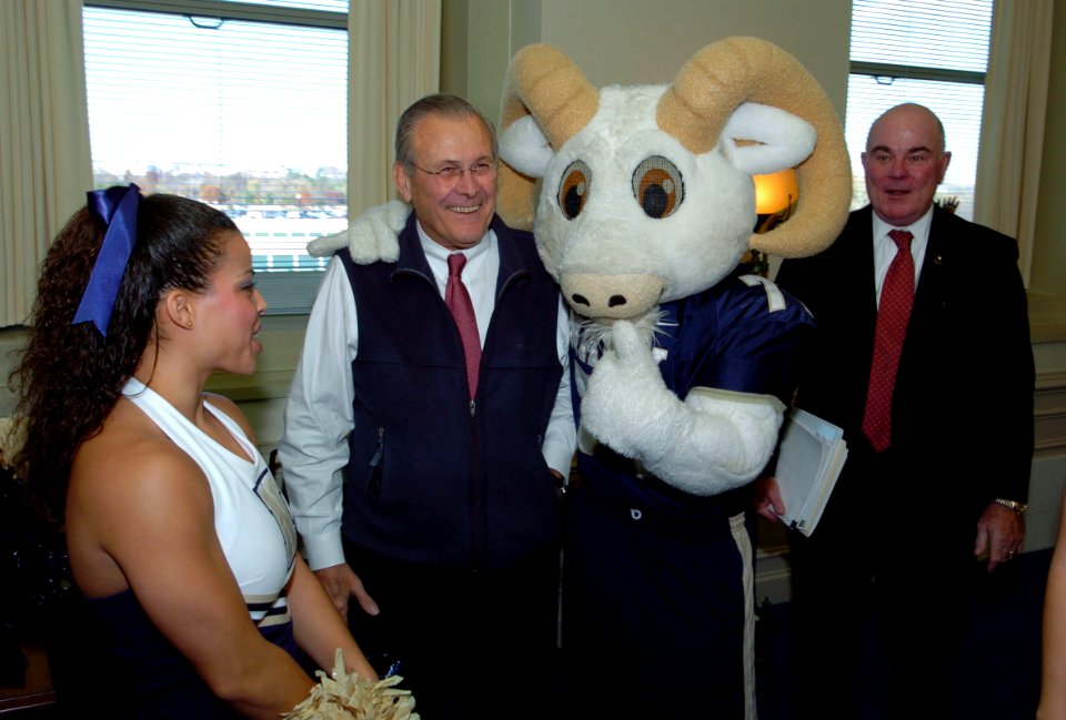 US Navy 051130-N-0295M-003 The U.S. Naval Academy mascot Bill the Goat poses for a photo with Secretary of Defense Donald Rumsfeld as Secretary of the Army Francis J. Harvey looks-on during a Pep-Rally