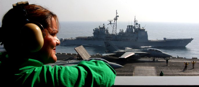 US Navy 051018-N-0685C-006 Lt. Cmdr. Joanna Garcia, from Tri Cities, Wash., looks over the fly deck aboard Nimitz-class aircraft carrier USS Theodore Roosevelt (CVN 71)