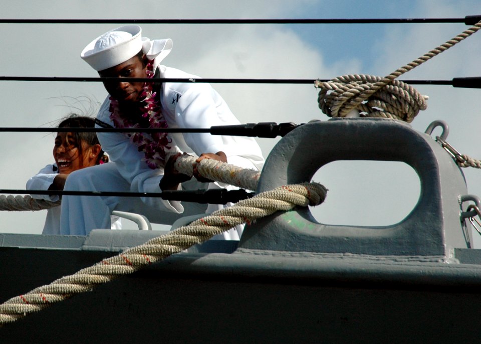 US Navy 051109-N-3019M-009 A Sailor assigned to the guided missile destroyer USS Chafee (DDG 90) heaves around on a line as the ship moors pierside on board Naval Station Pearl Harbor