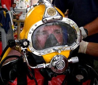 US Navy 051026-N-0000X-001 Electronics Technician 1st Class Matthew Ammons, a diver assigned to Mobile Diving and Salvage Unit Two (MDSU-2), is fitted with a Kirby Morgan 37 Dive Helmet