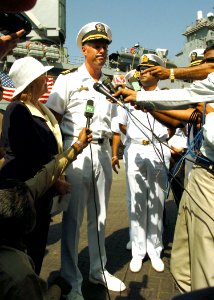 US Navy 051018-N-0716S-015 Commanding Officer, USS Pearl Harbor (LSD 52), Cmdr. Jonathan Harnden, center, and U.S. Consular General to Pakistan, Mary Witt, left, speak to Pakistani media
