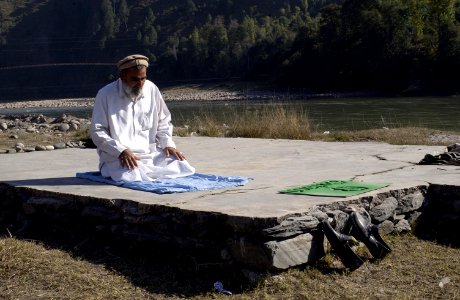 US Navy 051113-F-2729L-008 A Pakistani man prays at the Thuri Park Tent Village mosque in Muzaffarabad, Pakistan