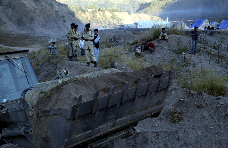 US Navy 051113-F-2729L-021 A U.S. Navy Seabee assigned to Naval Mobile Construction Battalion Seven Four (NMCB-74), levels the ground in Muzaffarabad, Pakistan