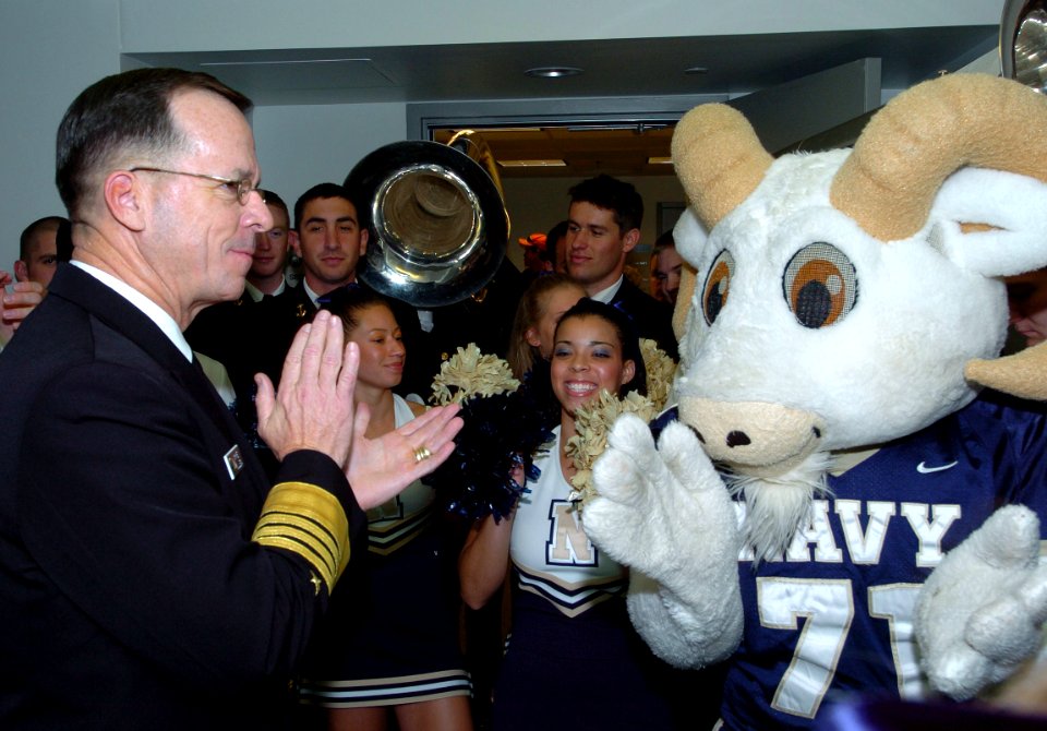 US Navy 051130-N-0295M-001 Chief of Naval Operations Mike Mullen applauds the U.S. Naval Academy cheerleaders and their mascot Bill the Goat during a Pep-Rally at the Pentagon