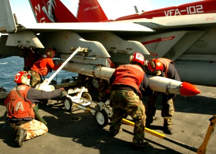 US Navy 051109-N-3488C-004 Aviation Ordnancemen assigned to the Diamondbacks of Strike Fighter Squadron One Zero Two (VFA-102), load a CATM-88 High-Speed Anti-Radiation (HARM) missile