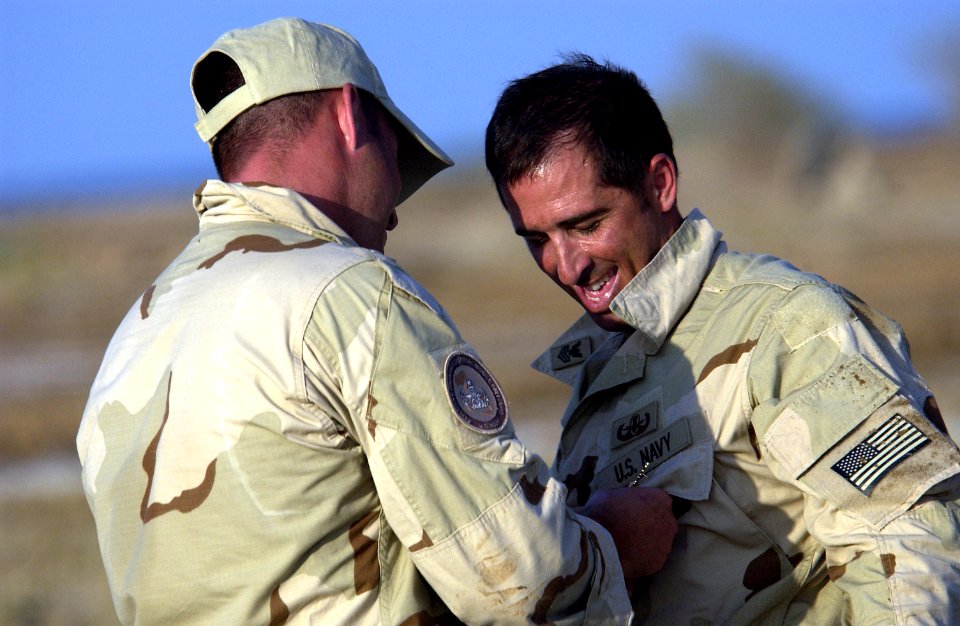 US Navy 051112-F-7234P-185 U.S. Navy Chief Zach Holzhausen, left, assigned to Explosive Ordnance Disposal Mobile Unit Eight (EODMU-8)