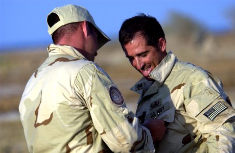 US Navy 051112-F-7234P-185 U.S. Navy Chief Zach Holzhausen, left, assigned to Explosive Ordnance Disposal Mobile Unit Eight (EODMU-8)