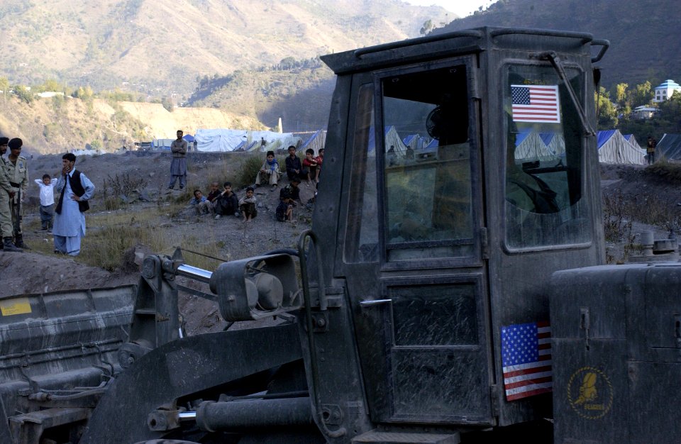 US Navy 051113-F-2729L-022 A U.S. Navy Seabee assigned to Naval Mobile Construction Battalion Seven Four (NMCB-74), levels the ground in Muzaffarabad, Pakistan