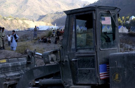US Navy 051113-F-2729L-022 A U.S. Navy Seabee assigned to Naval Mobile Construction Battalion Seven Four (NMCB-74), levels the ground in Muzaffarabad, Pakistan