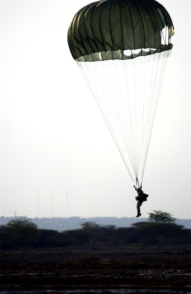 US Navy 051112-F-7234P-173 U.S. Navy Petty Officer 1st Class Frank Fazalore, assigned to Explosive Ordnance Disposal Mobile Unit Eight (EODMU-8), Detachment Four, lands safely