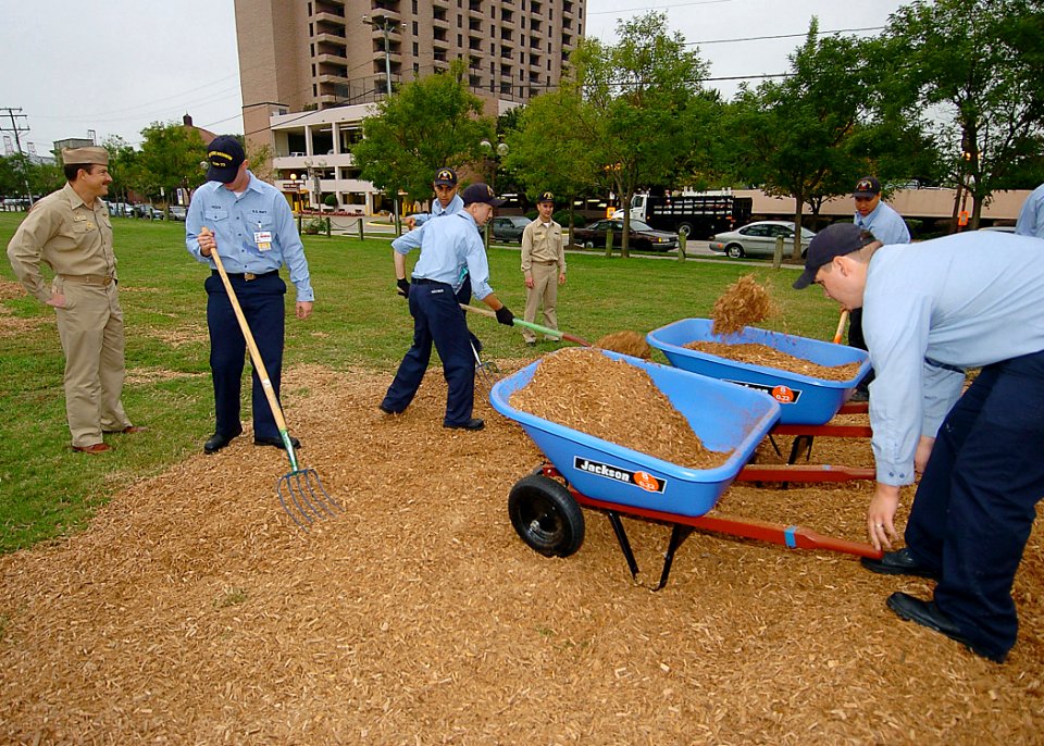 US Navy 051021-N-6278K-012 Commanding Officer, USS George Washington (CVN 73), Capt. Garry R. White oversees his Sailors cleaning up Huntington Park during one of the ship's Make a Difference Day community relations (COMR