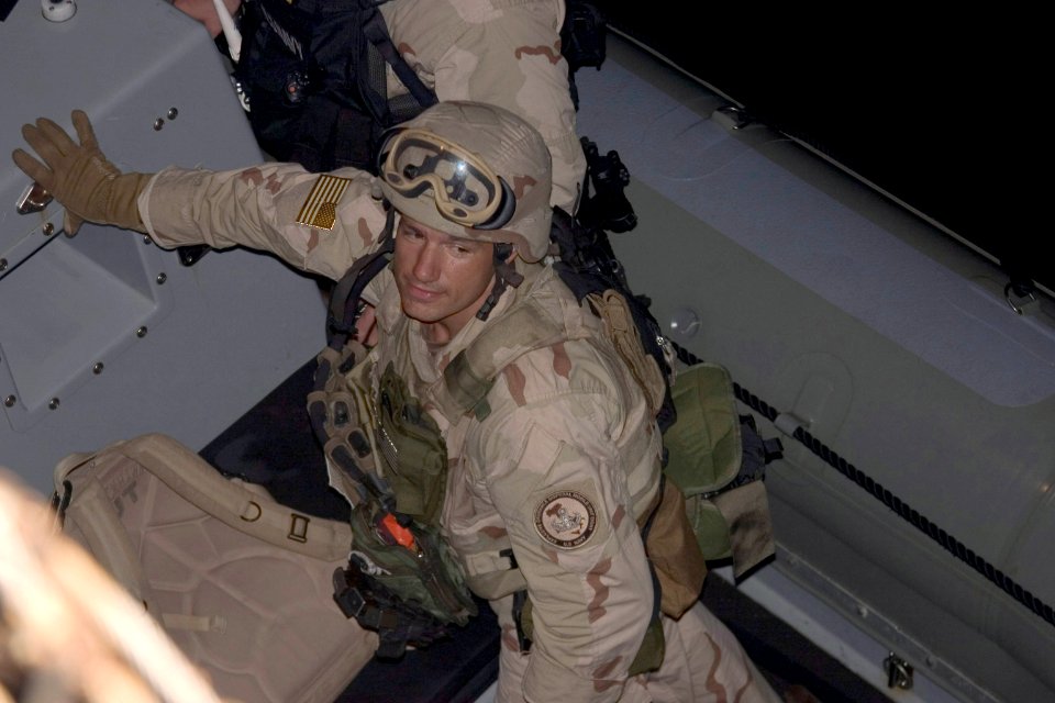 US Navy 051107-A-4824S-577 Engineman 1st Class Kelly Franz, assigned to Explosive Ordnance Disposal Mobile Unit Eight (EODMU-8), Detachment 4, prepares to board the cruise liner Seabourn Spirit
