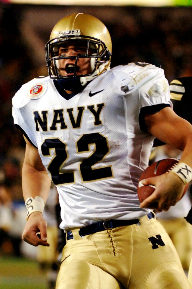 US Navy 051203-N-9693M-522 Navy fullback Adam Ballard (22) crosses the goal line for one of his two touchdowns during the 106th Army vs. Navy Football game
