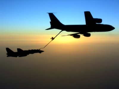 US Navy 051109-N-0000X-001 An F-14D Tomcat conducts aerial refueling with a U.S. Air Force KC-135 Stratotanker during a mission over the Persian Gulf region photo