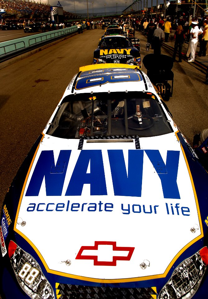 US Navy 051119-N-9769P-218 The NASCAR Busch No. 88 Navy - Accelerate Your life Chevrolet Monte Carlo of the Dale Earnhardt Jr. Racing Team, lines up in front of the No. 14 Navy Accelerate Your Life Dodge Charger