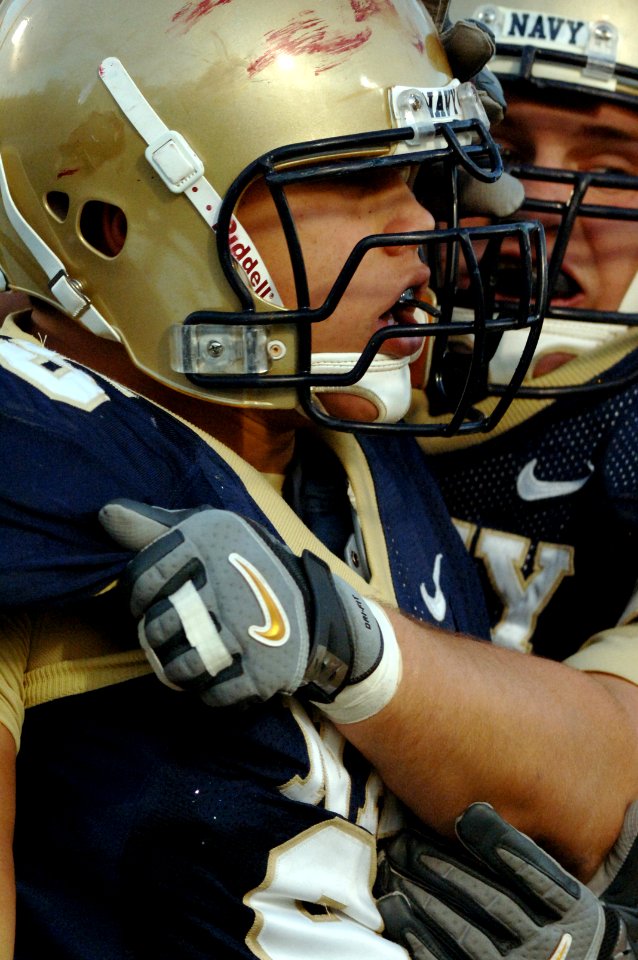 US Navy 051119-N-9693M-025 U.S. Naval Academy Midshipman defensive end John Chan (foreground) is congratulated on running in a 41 yard touchdown following a Temple Owls fumble during the 4th quarter of play at Navy-Marine Corps