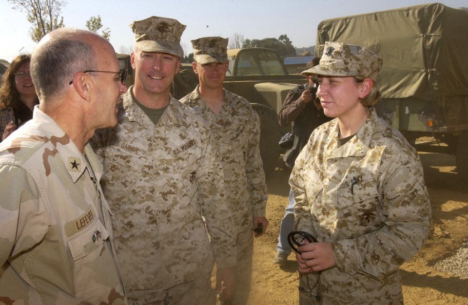 US Navy 051123-F-9927R-013 Commander, Disaster Assistance Center – Pakistan, U.S. Navy Rear Adm. Mike Lefever, speaks with U.S. Navy Lt. Kimberly N. Livingston, about the conditions of the patients