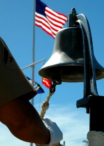 US Navy 051114-N-3019M-002 U.S. Marine Corps Lance Cpl. Devon Goodwin sounds a bell honoring fallen Marines during a ceremony