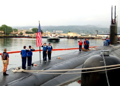 US Navy 051129-N-0879R-001 Submariners aboard the Los Angeles-class fast attack submarine USS Chicago (SSN 721) salute during morning colors