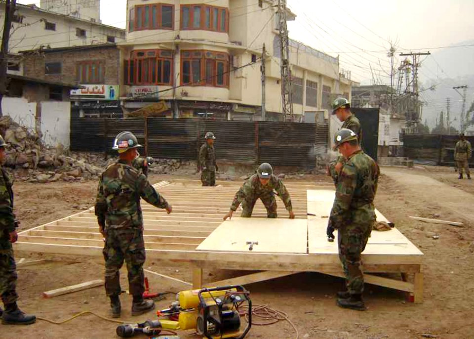 US Navy 051218-N-0000X-005 Sailors assigned to Naval Mobile Construction Battalion Four (NMCB-4) construct temporary buildings during disaster relief efforts