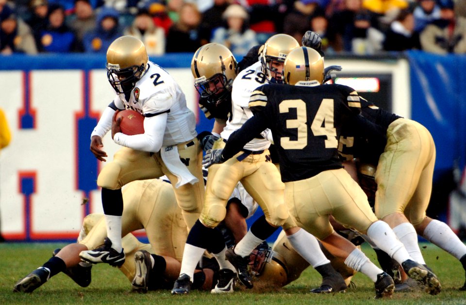 US Navy 051203-N-9693M-507 Navy Quarterback Lamar Owens (2) breaks out of the line of scrimmage to gain yardage during the 106th Army vs. Navy Football game, held for the third consecutive year at Lincoln Financial Field
