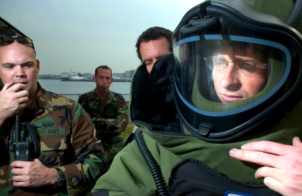 US Navy 051202-N-9851B-005 U.S. Navy Mineman 1st Class Kieth Pierson, assigned to Explosive Ordnance Disposal Mobile Unit Five (EODMU-5), Detachment Japan, has communication equipment attached to his protective bomb suit