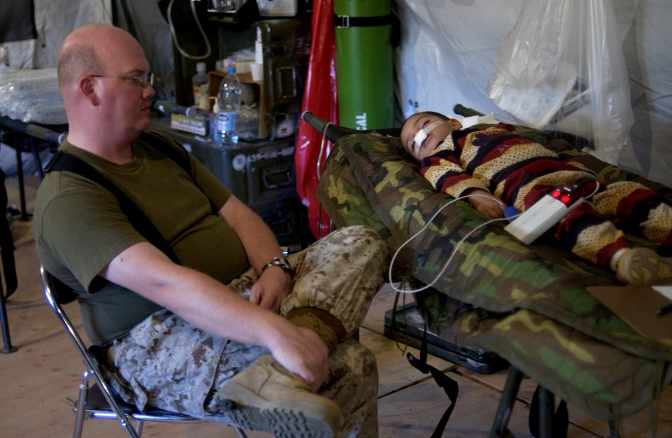 US Navy 051120-F-2729L-001 U.S. Navy Lt. Scott Avery, assigned to 3rd Medical Battalion, 3rd Marine Logistics Group, III Marine Expeditionary Force, monitors a young Pakistani's recovery