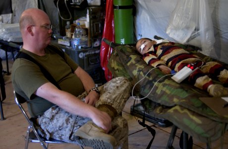 US Navy 051120-F-2729L-001 U.S. Navy Lt. Scott Avery, assigned to 3rd Medical Battalion, 3rd Marine Logistics Group, III Marine Expeditionary Force, monitors a young Pakistani's recovery
