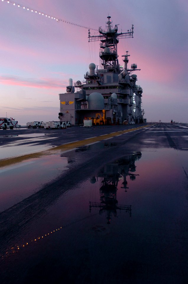 US Navy 060101-N-9866B-337 The amphibious assault ship USS Peleliu (LHA 5) home ported at Naval Station San Diego displays her holiday lights in celebration during the first morning sunrise of the New Year