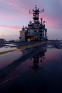 US Navy 060101-N-9866B-337 The amphibious assault ship USS Peleliu (LHA 5) home ported at Naval Station San Diego displays her holiday lights in celebration during the first morning sunrise of the New Year