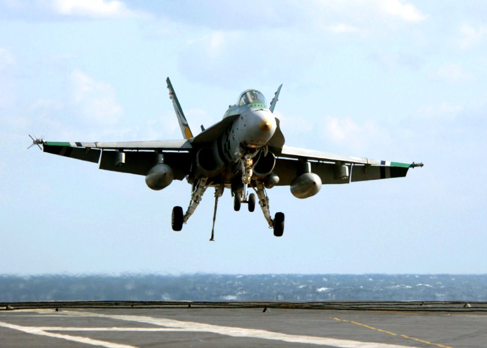 US Navy 051109-N-3488C-090 An F-A-18C Hornet, assigned to the Dambusters of Strike Fighter Squadron One Nine Five (VFA-195), prepares to catch an arresting gear