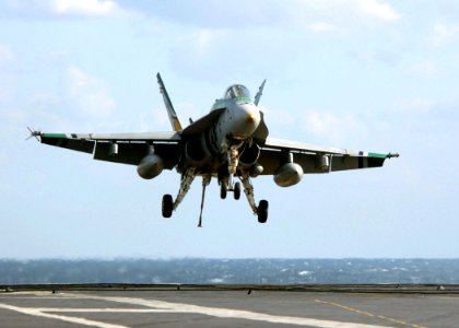 US Navy 051109-N-3488C-090 An F-A-18C Hornet, assigned to the Dambusters of Strike Fighter Squadron One Nine Five (VFA-195), prepares to catch an arresting gear