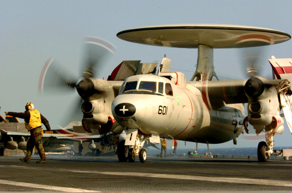 US Navy 051111-N-3488C-004 An Aviation Boatswain's Mate directs an E-2C Hawkeye, assigned to the Liberty Bells