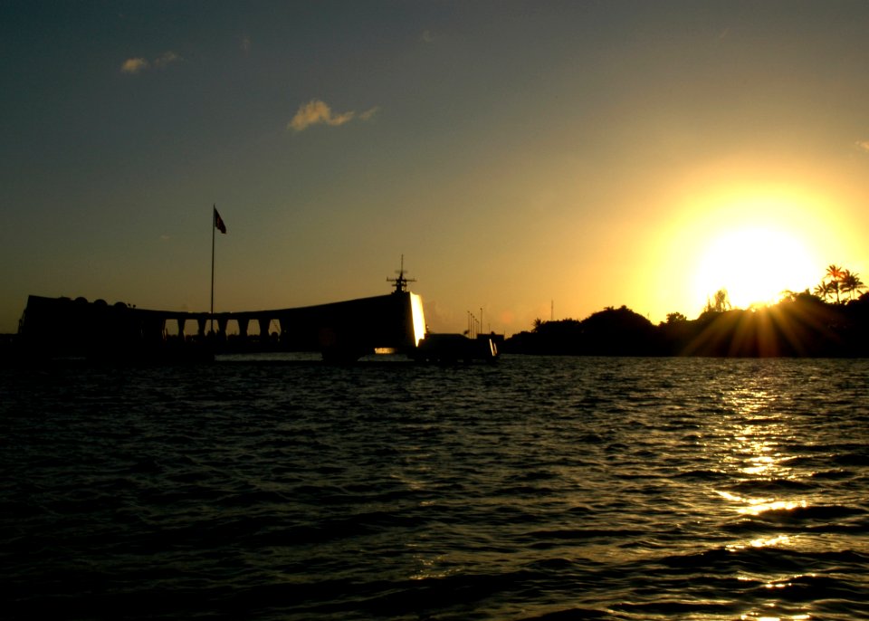 US Navy 051206-N-3019M-001 The sun sets next to the USS Arizona Memorial on the eve of the 64th commemoration of the Dec. 7, 1941 attack on Pearl Harbor, Hawaii
