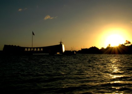 US Navy 051206-N-3019M-001 The sun sets next to the USS Arizona Memorial on the eve of the 64th commemoration of the Dec. 7, 1941 attack on Pearl Harbor, Hawaii