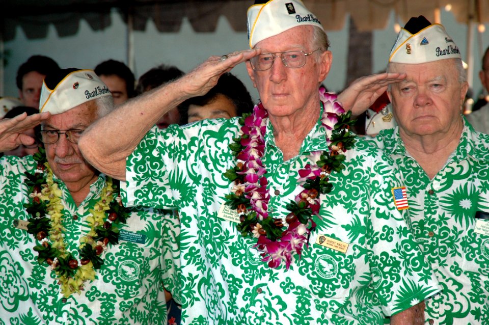 US Navy 051207-N-3019M-008 Pearl Harbor survivors salute the National Ensign during the 64th commemoration of the Dec. 7, 1941 attack on Pearl Harbor