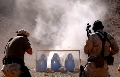 US Navy 051114-F-7234P-239 U.S. Navy Explosive Ordnance Disposal Mobile Unit Eight (EODMU-8), Detachment Four, team members, Petty Officer 1st Class David Strogylos, left, and Petty Officer 2nd Class Clayton Pressley, fire thei