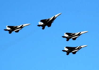 US Navy 051207-N-3019M-006 Four F-15 Eagle fighter aircraft, assigned to the Hawaii Air National Guard, perform a missing man flyover as part of the 64th commemoration