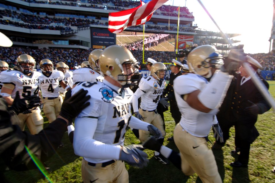 US Navy 051203-N-9693M-003 The Naval Academy Midshipmen take to the field during opening ceremonies for the 106th playing of Army vs. Navy Football game