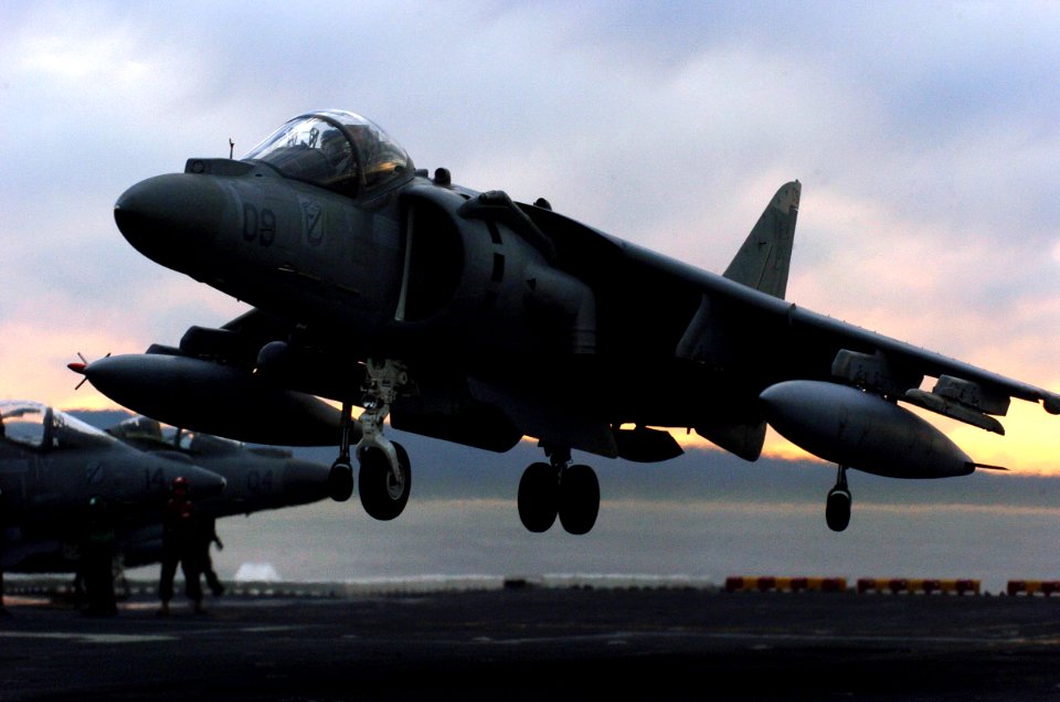 US Navy 051210-N-9866B-123 An AV-8B Harrier lands on the flight deck of the amphibious assault ship USS Peleliu (LHA 5)