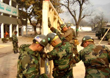 US Navy 051218-N-0000X-007 Sailors assigned to Naval Mobile Construction Battalion Four (NMCB-4) construct temporary buildings during disaster relief efforts
