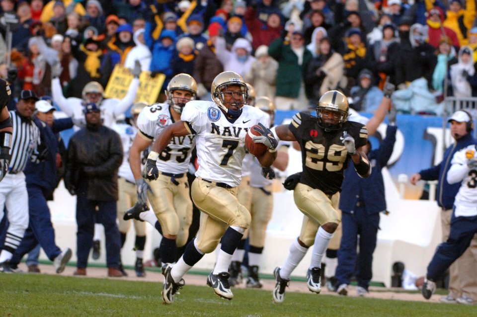 US Navy 051203-N-9693M-276 Navy slot back Reggie Campbell from Sanford, Fla., runs for a touch down during 2nd quarter play