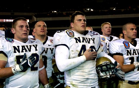 US Navy 051203-G-9409S-057 The U.S. Naval Academy Midshipmen team sing their Alma Mater following a 42-23 win over the Black Knights of Army, at the 106th playing of Army vs. Navy Football game