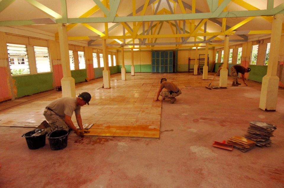 US Navy 051224-N-4374S-004 U.S. Navy Seabees, assigned to Naval Mobile Construction Battalion Three (NMCB-3), conduct floor restoration project at the Providence Hall in St. Elisabeth Convent, a daycare center in Seychelles